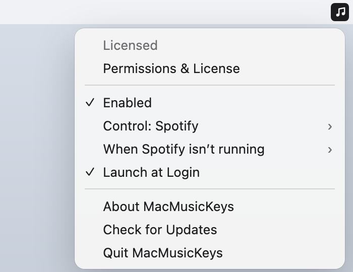 MacMusicKeys menu-bar extra open, showing Enabled, Control: Spotify, and When Spotify isn’t running